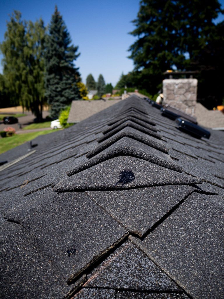 A photo of a ridge vent on the top of a roof.