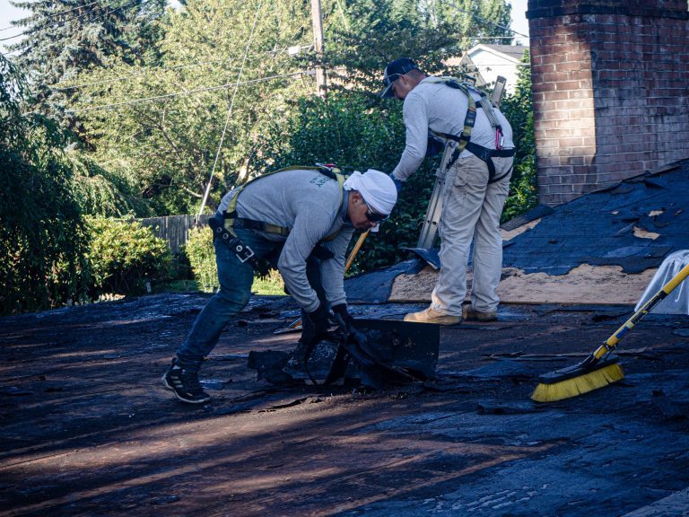 A Cherry Roofing crew hard at work on a roof.