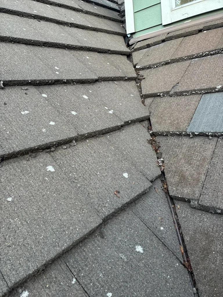 Tile Roof Valley With Debris Buildup Before Leak Repair in Vancouver, WA