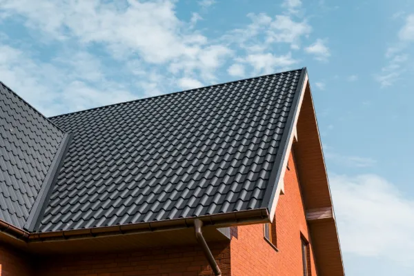 Residential home with durable metal shingle roofing.