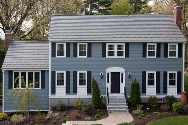 Two-story home with a well-maintained roof, an example of how roof replacement can help a house sell faster.