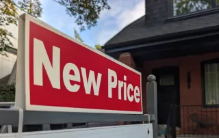 New Price sign in front of a home for sale, highlighting how roof condition affects a home sale in Vancouver, WA.