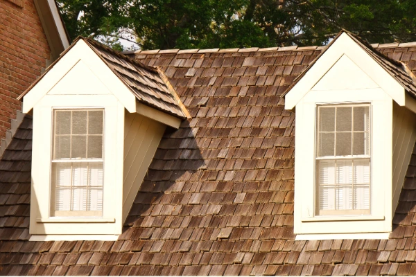 Cedar shake roof with dormer windows on a residential home